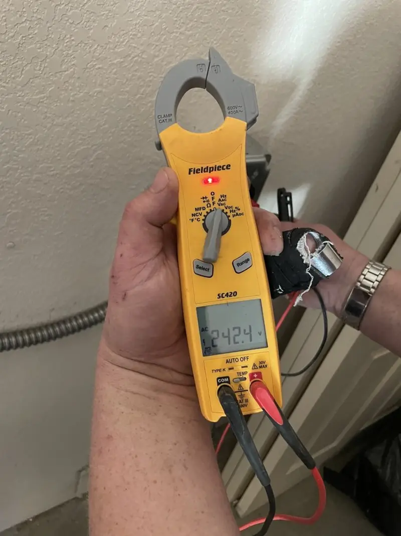 Voltage testing with clamp meter during Outlet Installation in Ocean Springs